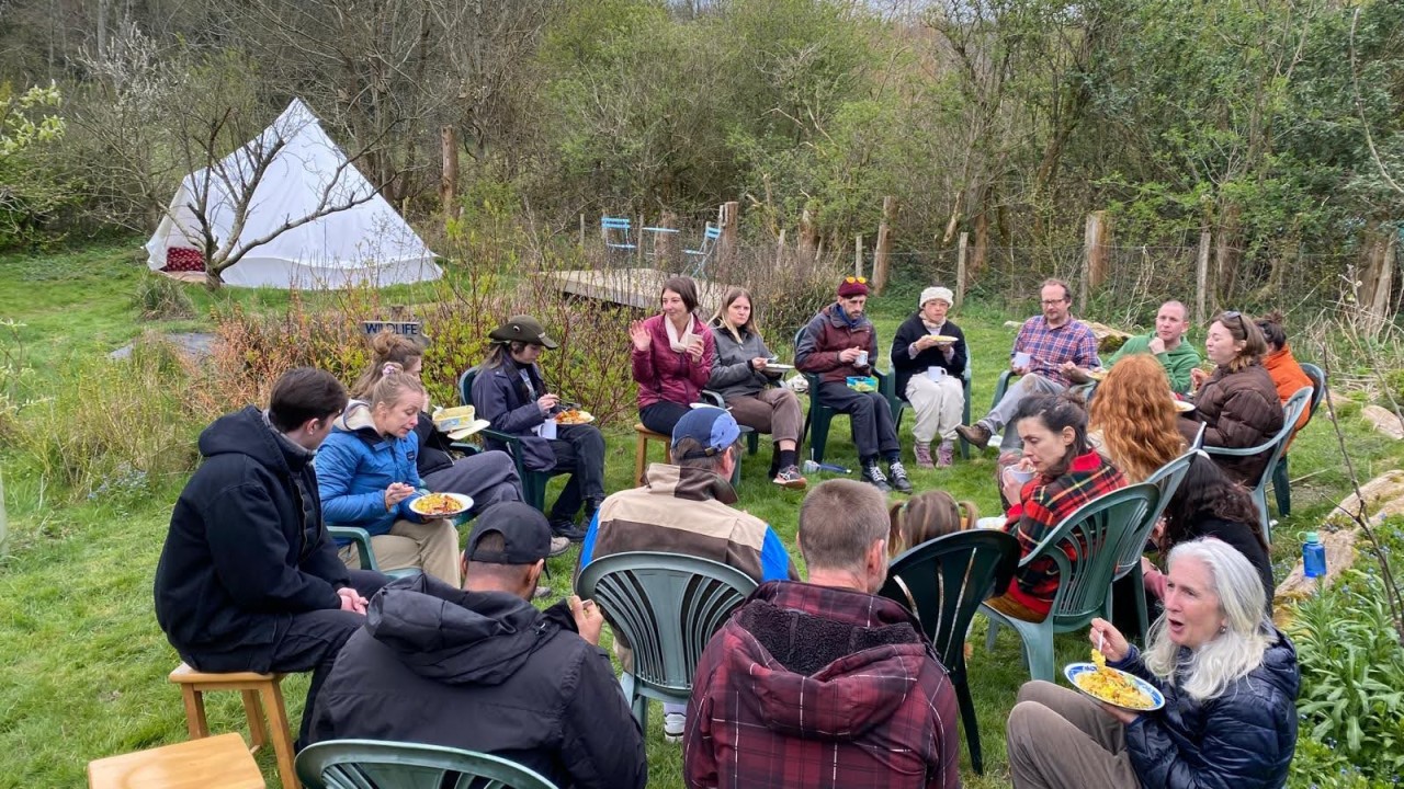 People sharing lunch at the Living Vital community garden